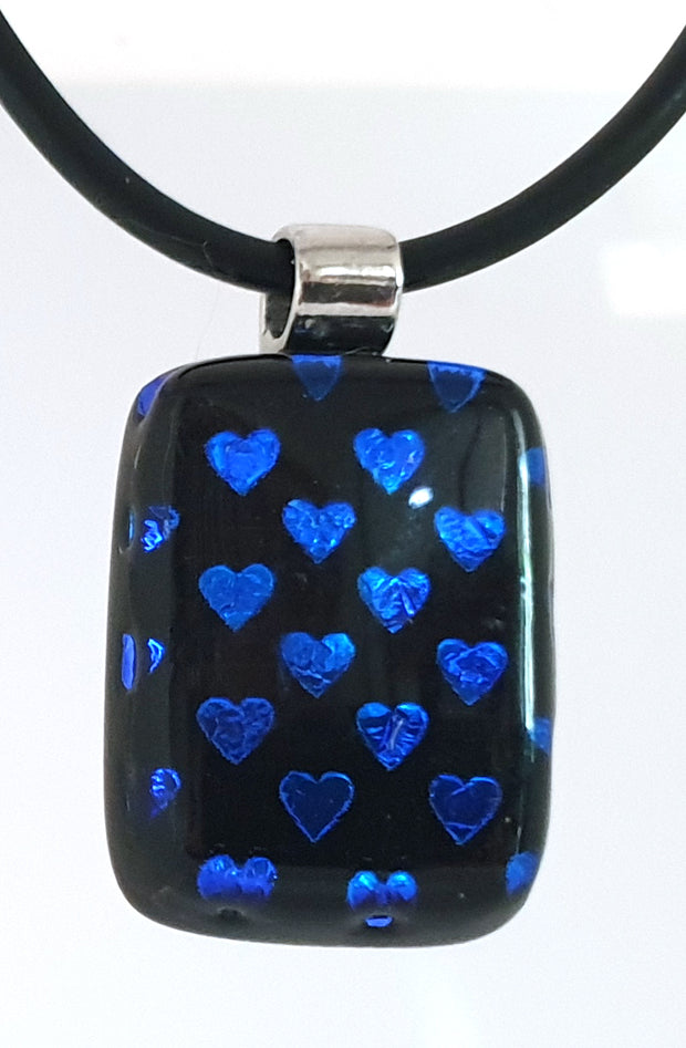 Small glass black pendant with tiny blue hearts