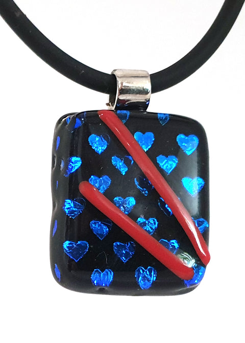 Black pendant with dichroic blue hearts and red detail