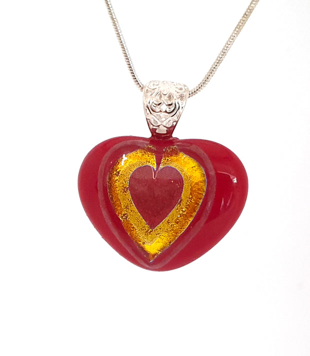 Red glass heart with dichroic heart inset