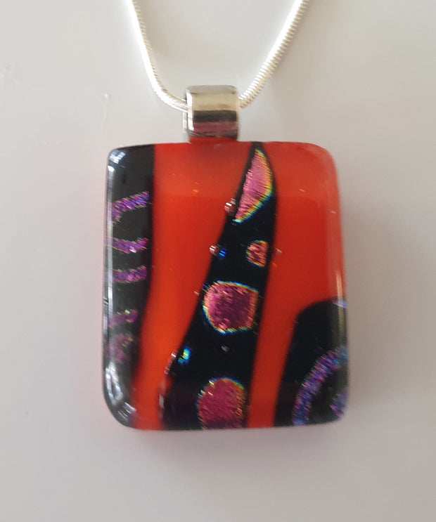 red dichroic pendant qith purple and red design