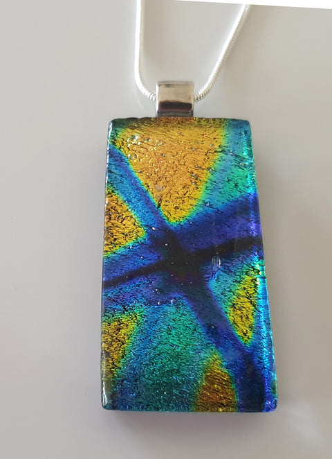 blue with gold dichroic glass pendant 4cms by 2cms with a 44cm chain