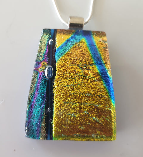 gold dichroic pendant with blue and mauve with 3 tiny bubbles