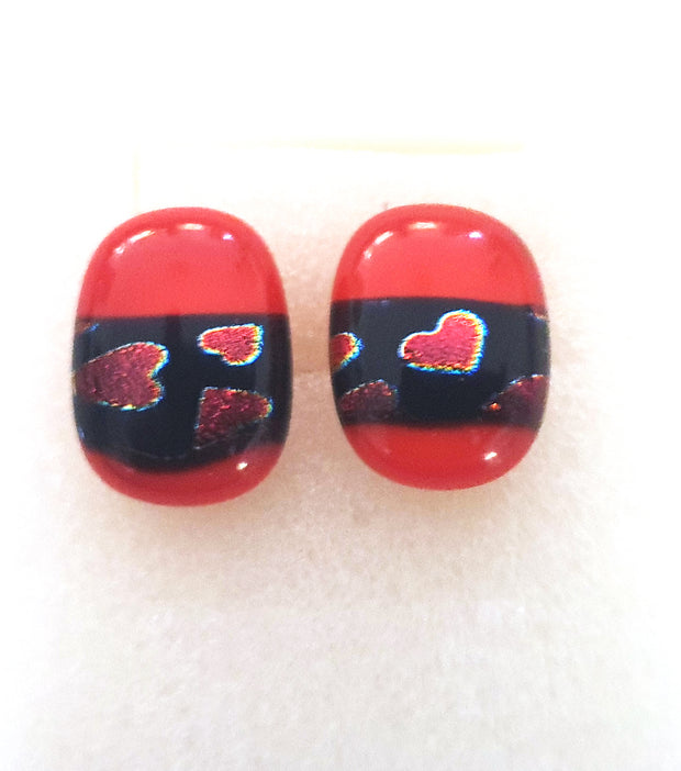 Red Earrings with red dichroic hearts on black background
