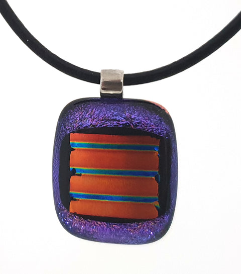 Shimmering Purple pendant with amber centre on black leather cord