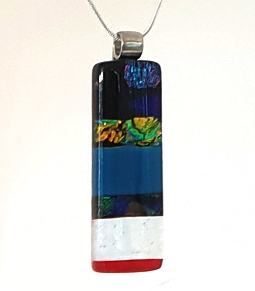 deep blue pendant with gold green and blue dichroic detail 