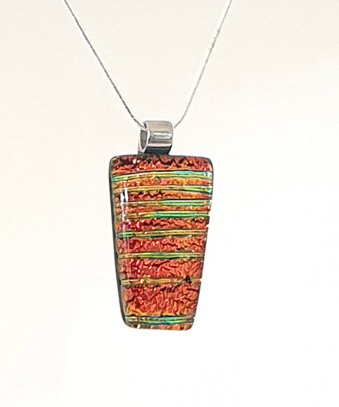 shimmering orange with gold striped dichroic glass pendant 3.5 cms by 2 cms with a 44 cm chain