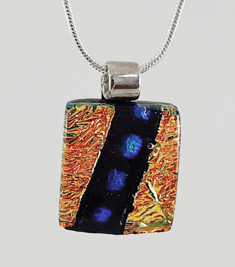 Petite dichroic pendant gold background with blue and black sash design